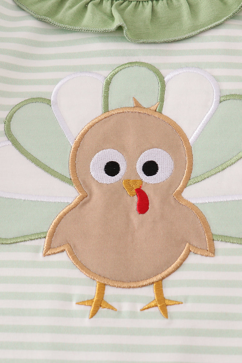 Turkey applique on a striped fabric background