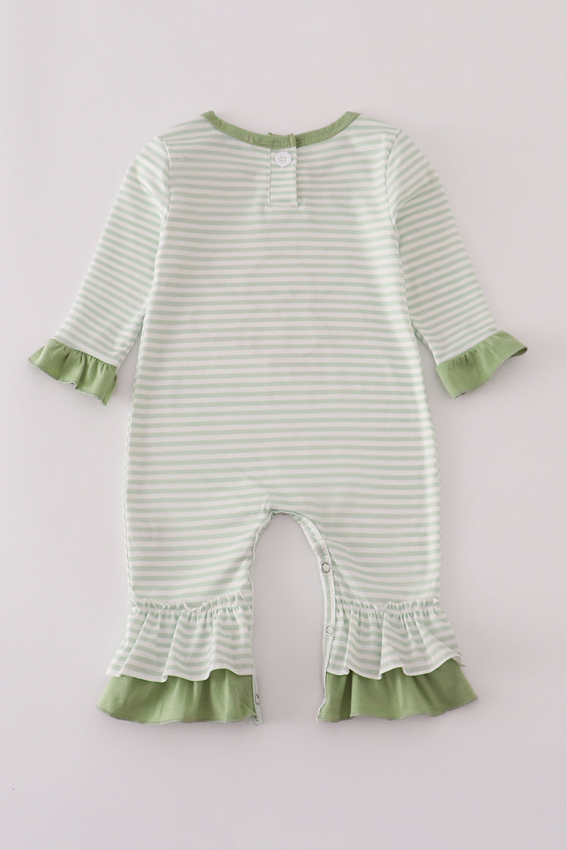 Green and white striped baby romper with ruffled details on a light gray background