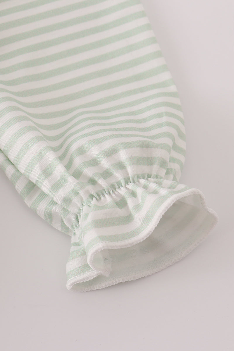 Green and white striped baby bloomers on a light gray background