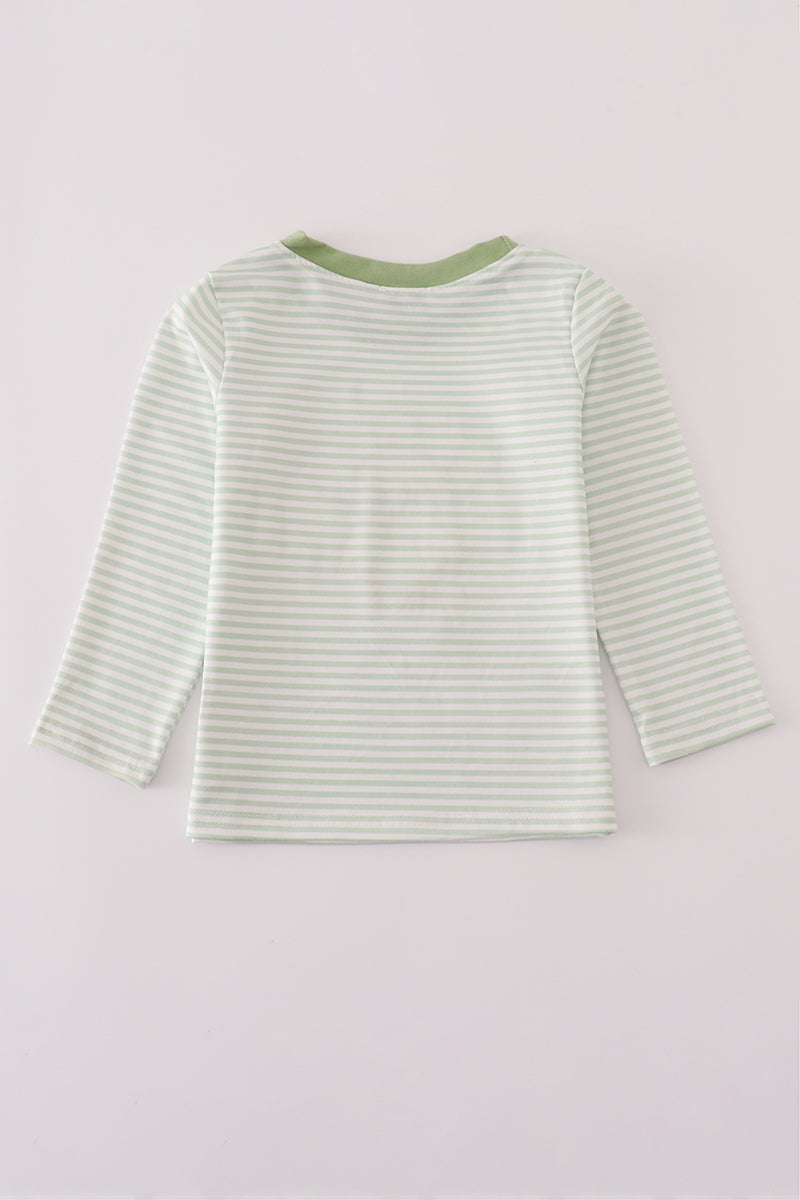 Green and white striped long-sleeve shirt on a light gray background