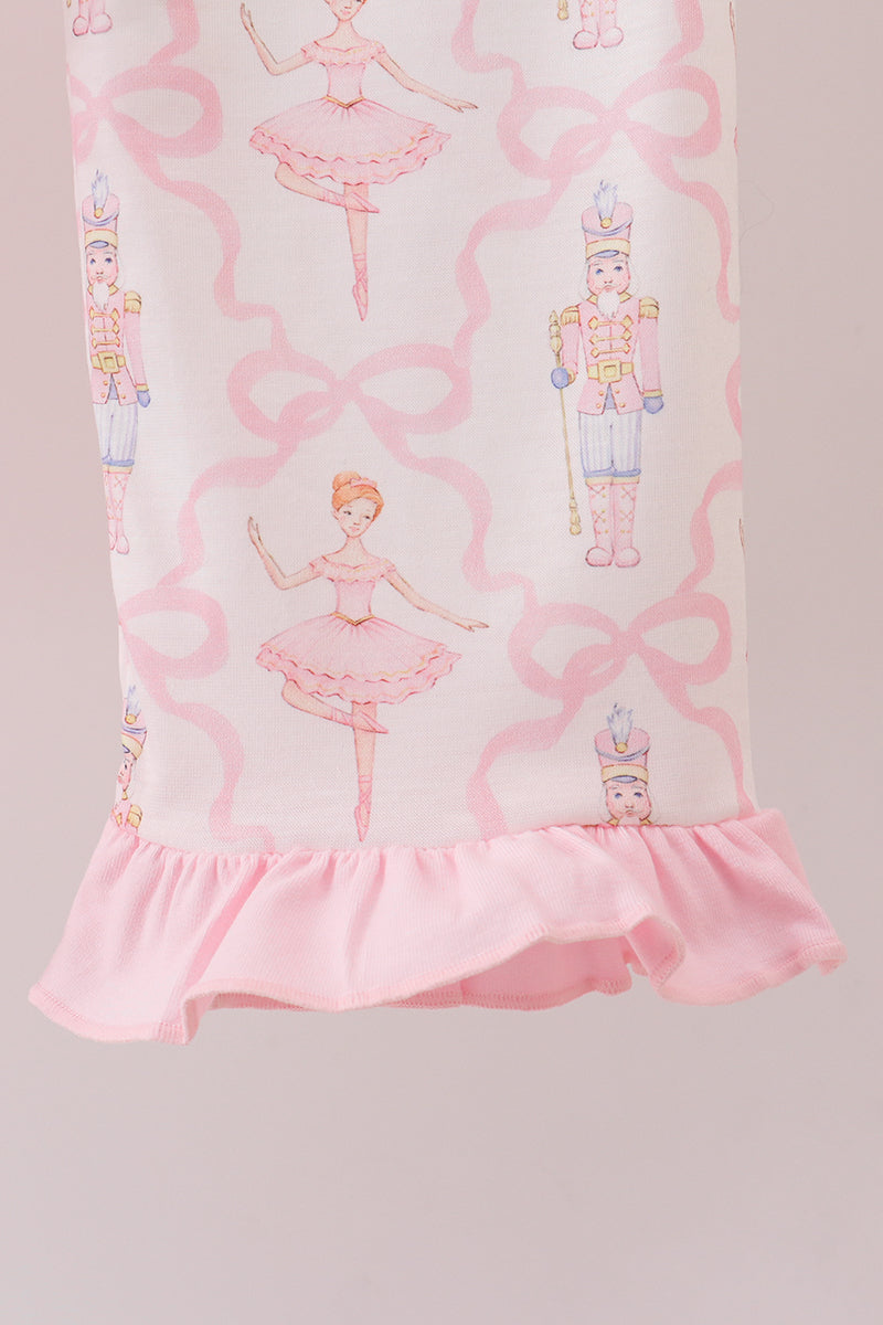 Pink dress with ballerina and Nutcracker design on a light pink background