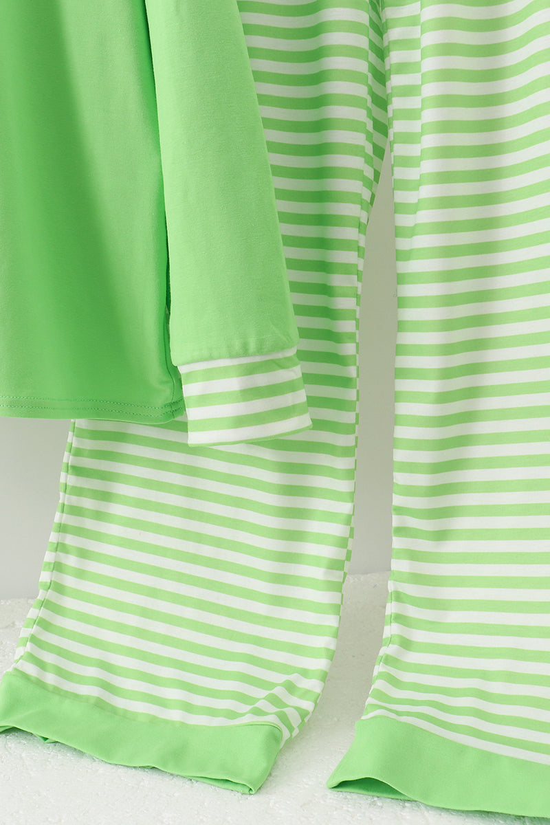 Green and white striped fabric on a white background