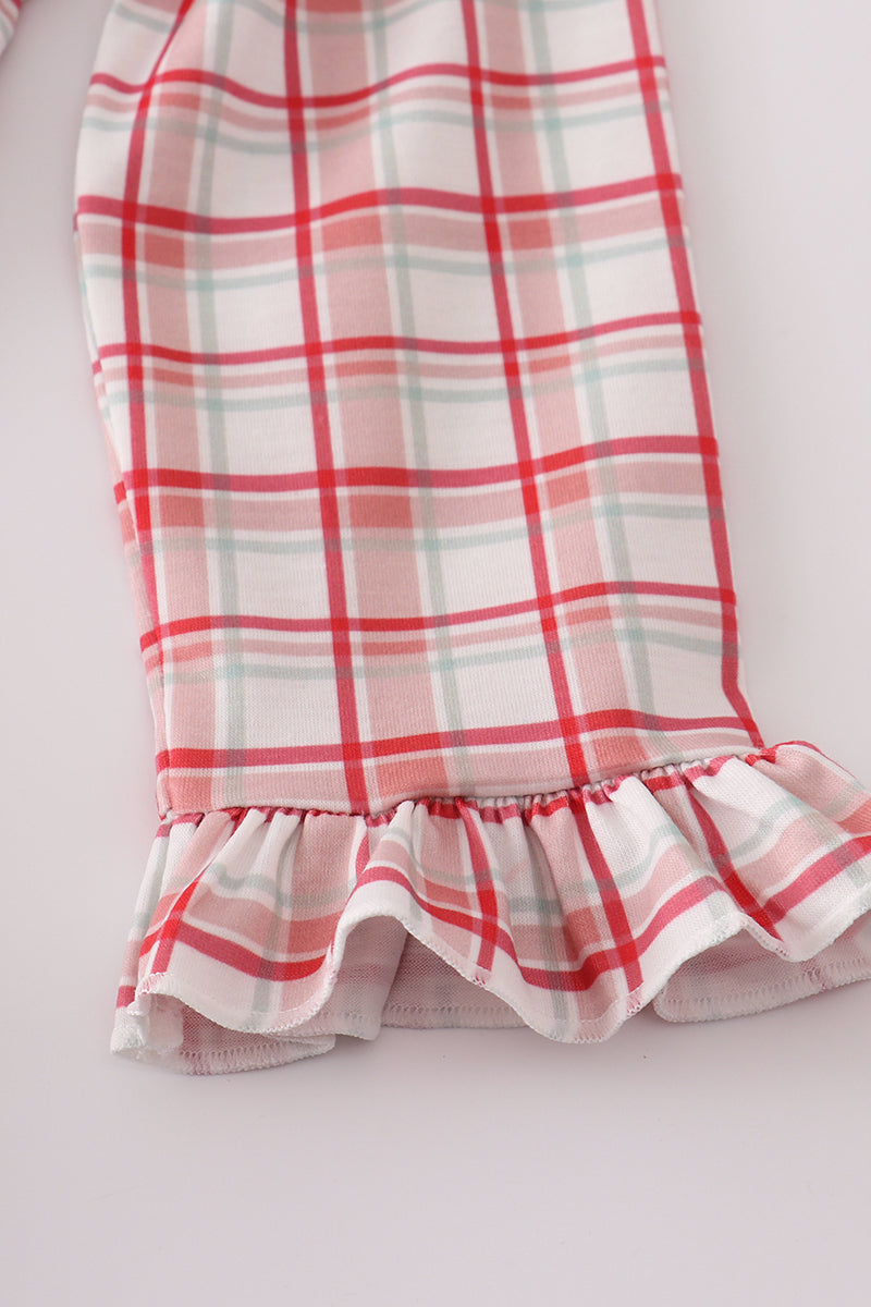 Plaid skirt with ruffled hem on a light background
