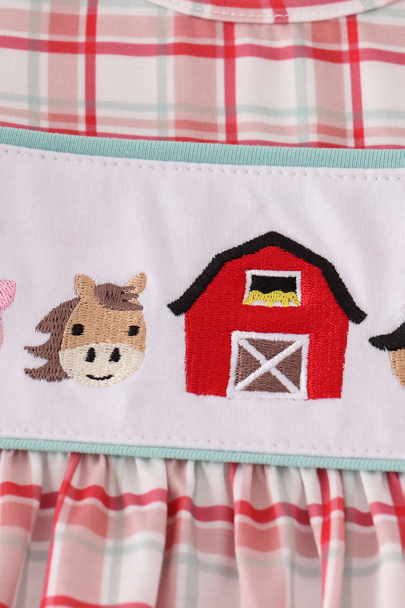 Children's dress with horse and barn design on plaid fabric