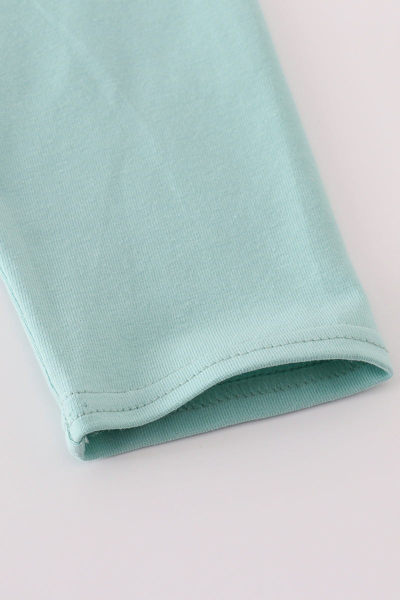 Close-up of a light blue fabric on a white background