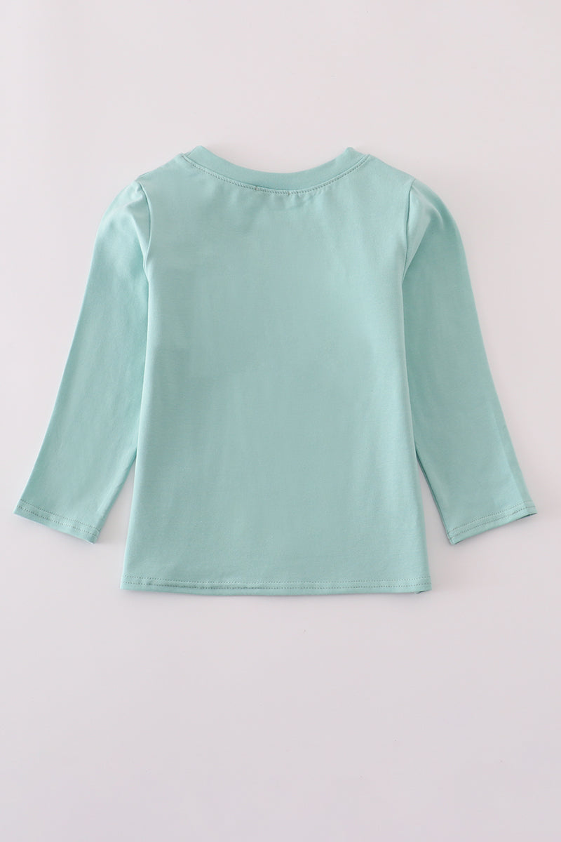 Light blue long-sleeve shirt on a light gray background