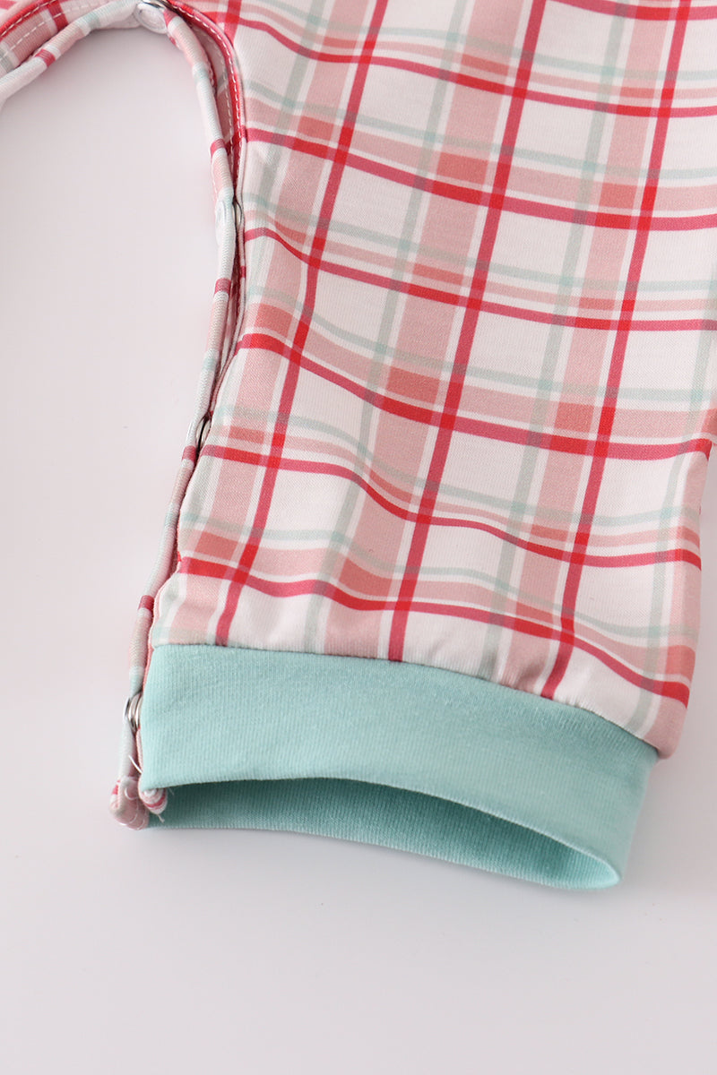 Plaid fabric with a light blue hem on a white background