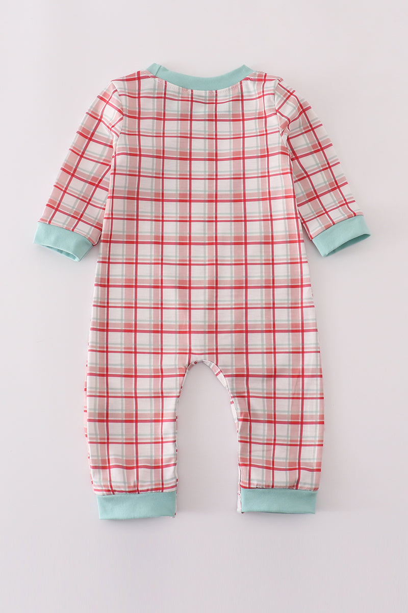 Plaid baby onesie with red and white pattern on a light gray background