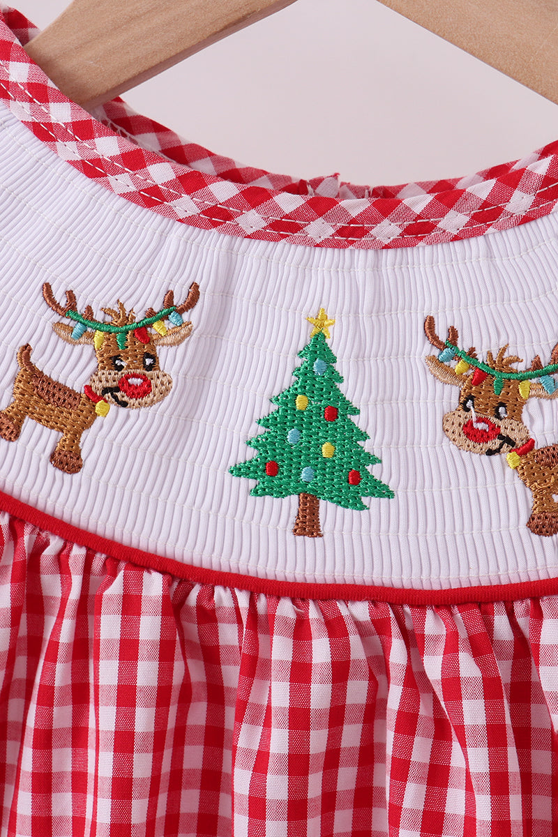 Children's outfit with Christmas-themed design featuring reindeer and a tree on a white background.