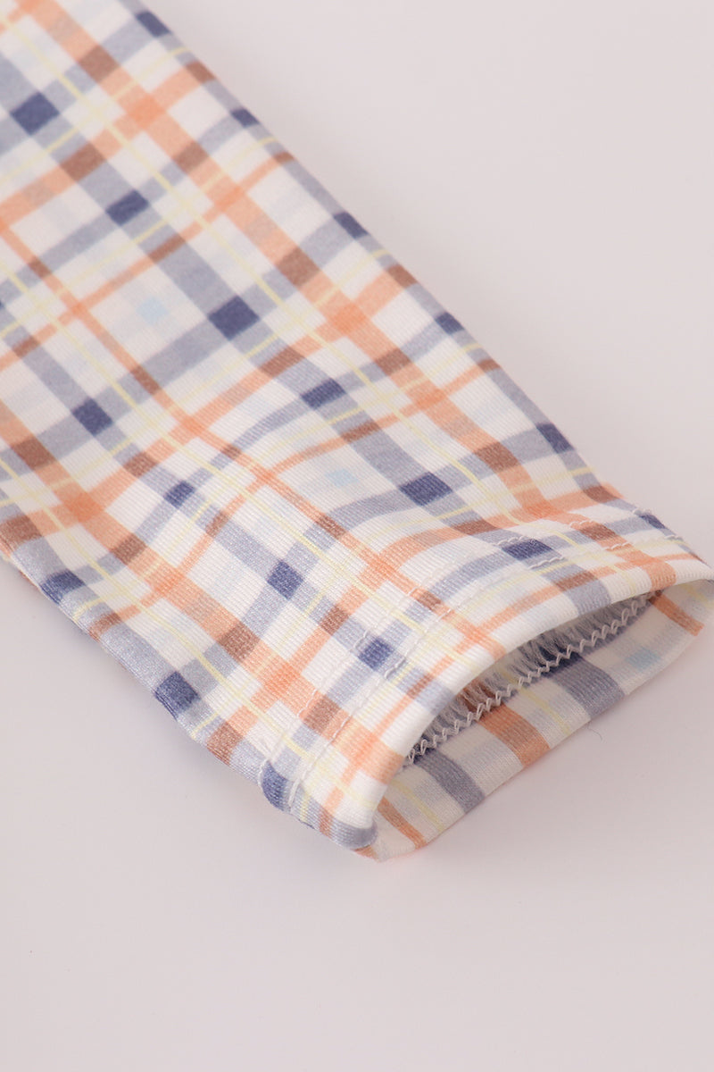 Plaid fabric with pastel colors on a light gray background