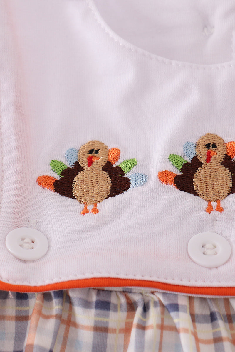 Children's bib with embroidered turkeys and plaid trim