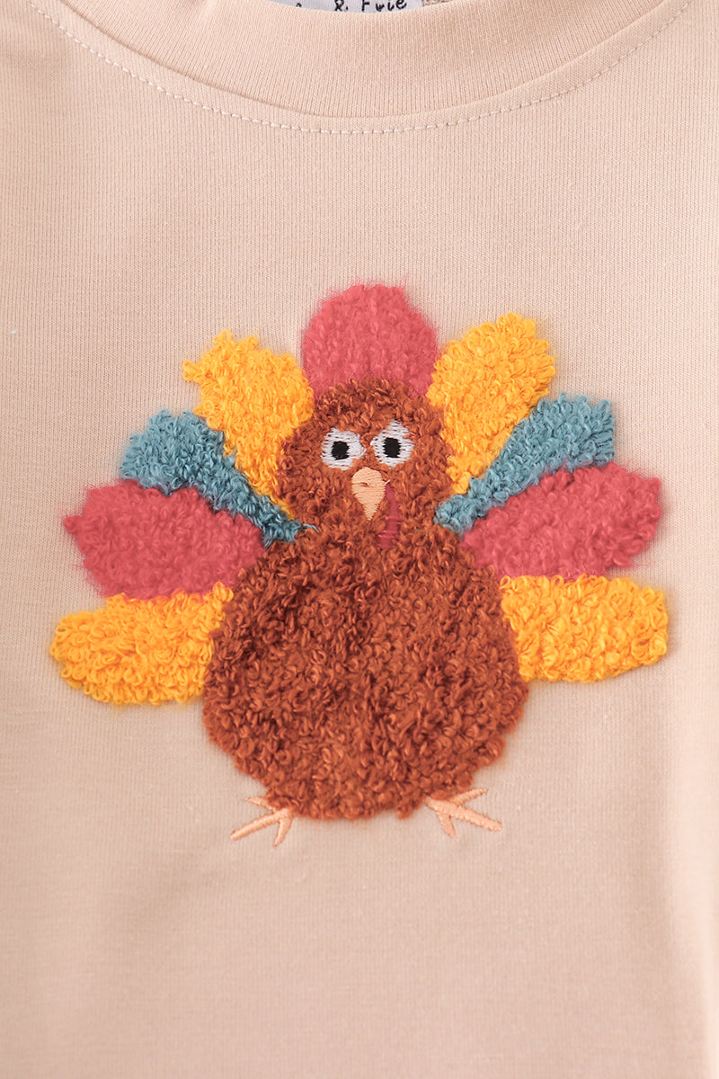 Turkey appliqué on a beige background