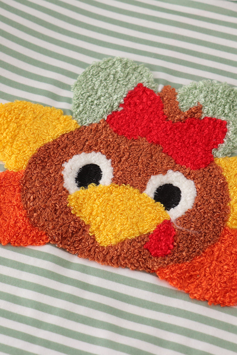 Turkey-shaped rug with a striped background