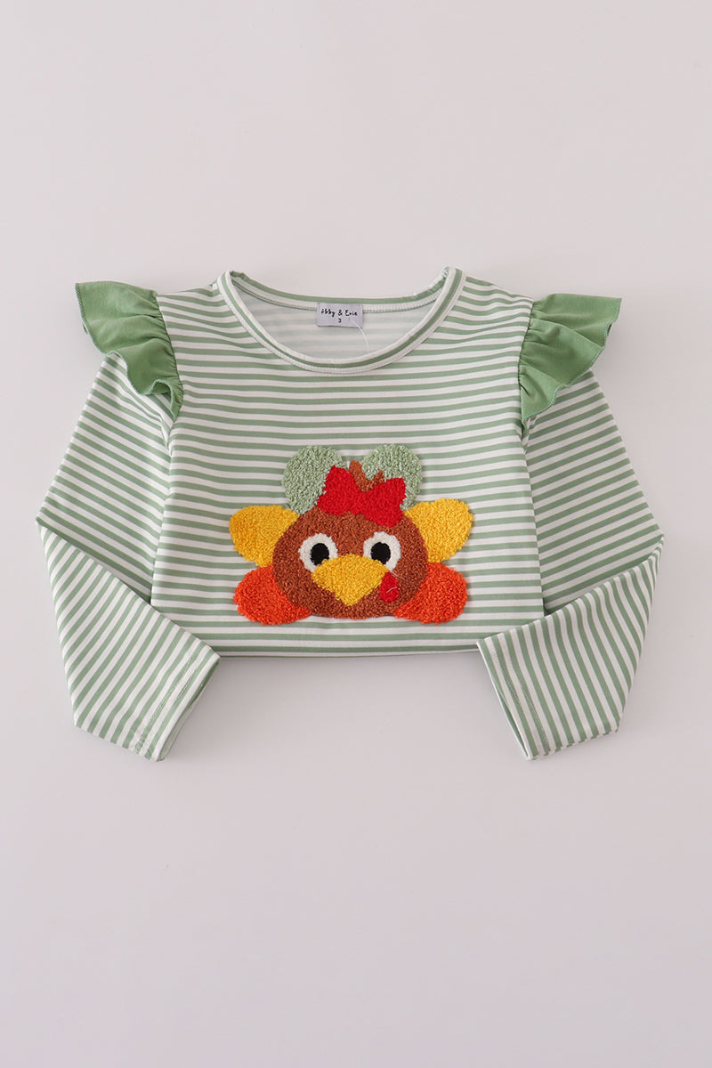 Green and white striped shirt with a turkey applique on a light gray background