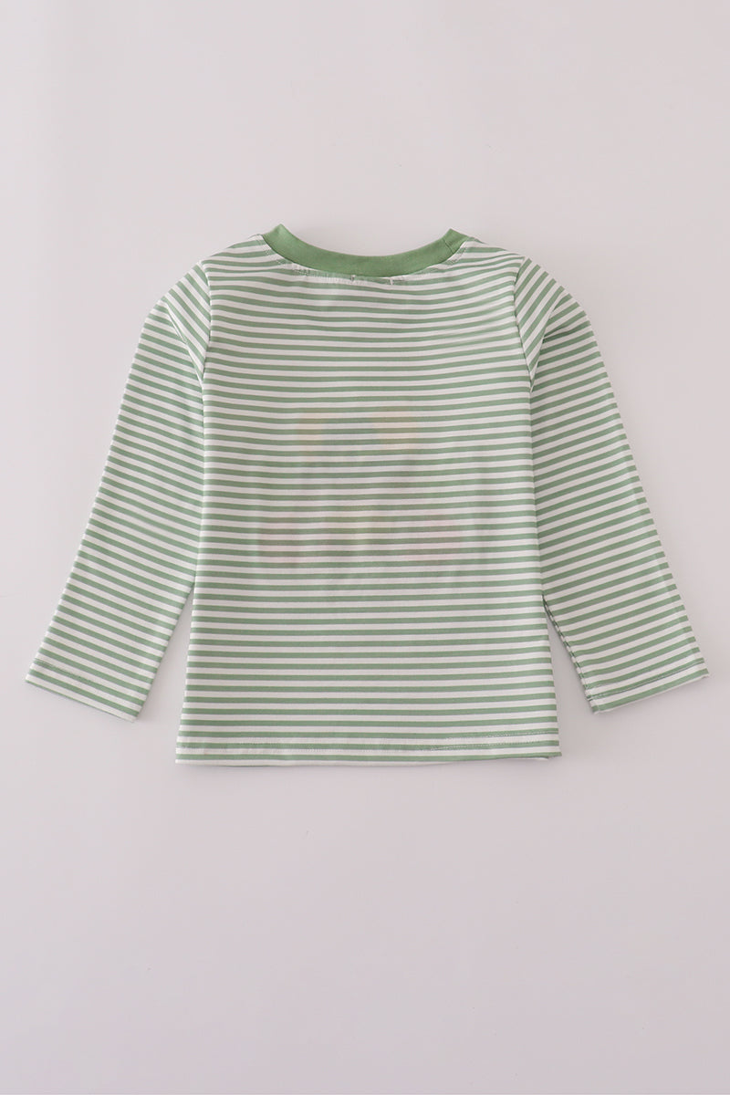 Green and white striped shirt on a light gray background