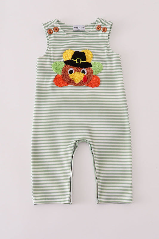Green and white striped romper with a turkey design on a light gray background