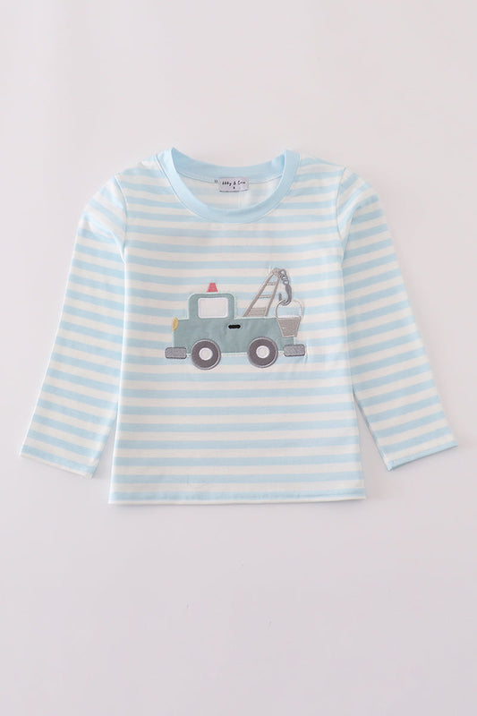 Striped long-sleeve shirt with a tow truck design on a light gray background