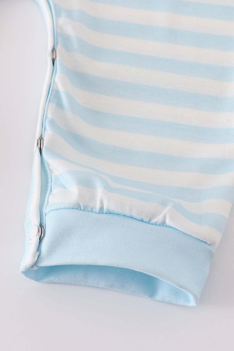 Light blue and white striped pouch on a light gray background