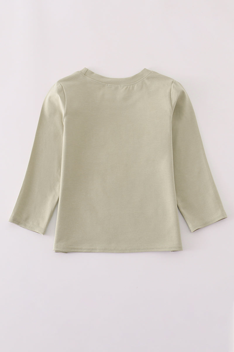 Light green long-sleeve top on a white background