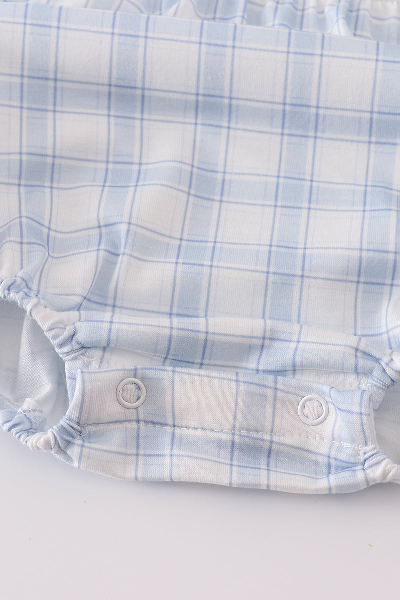 Plaid patterned diaper on a white background
