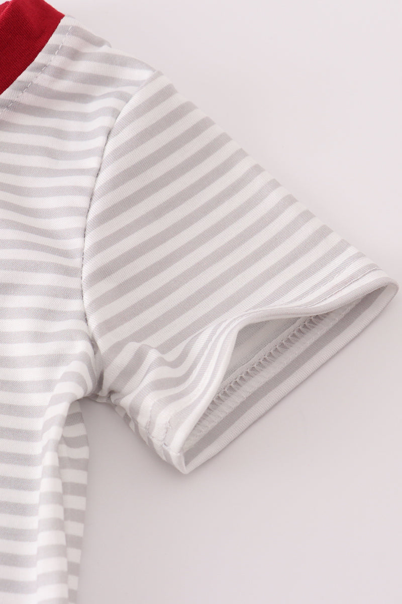 Close-up of a gray and white striped garment on a light background