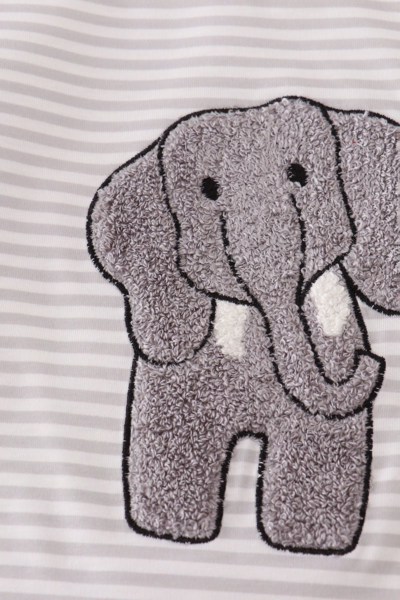 Gray elephant patch on a striped fabric background