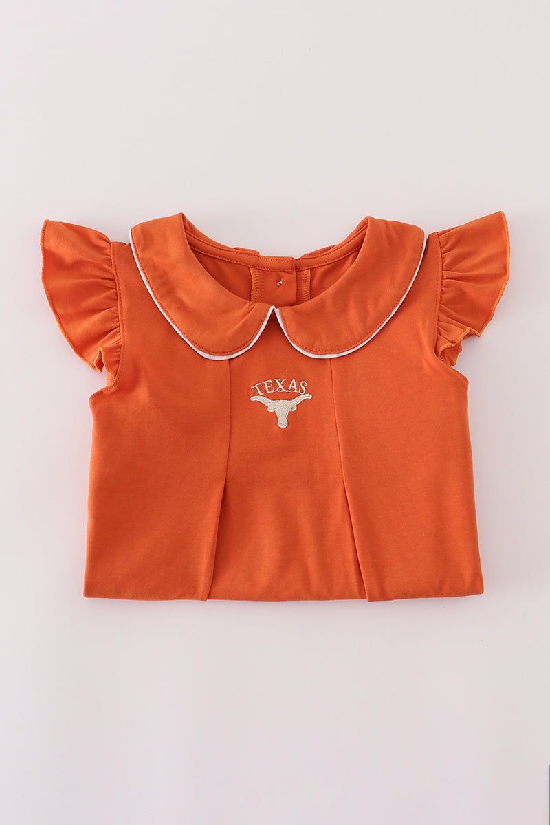Orange blouse with ruffled collar and 'Texas' logo on a light gray background