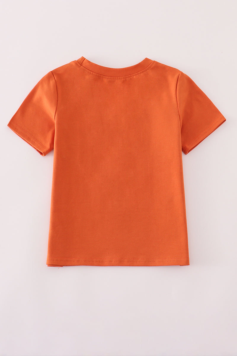 Orange t-shirt on a light gray background