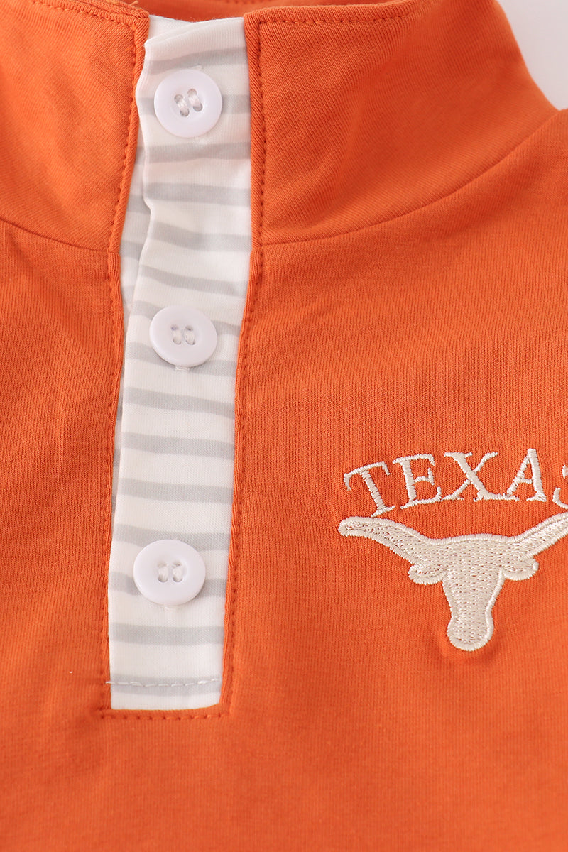 Orange shirt with white buttons and Texas Longhorn logo