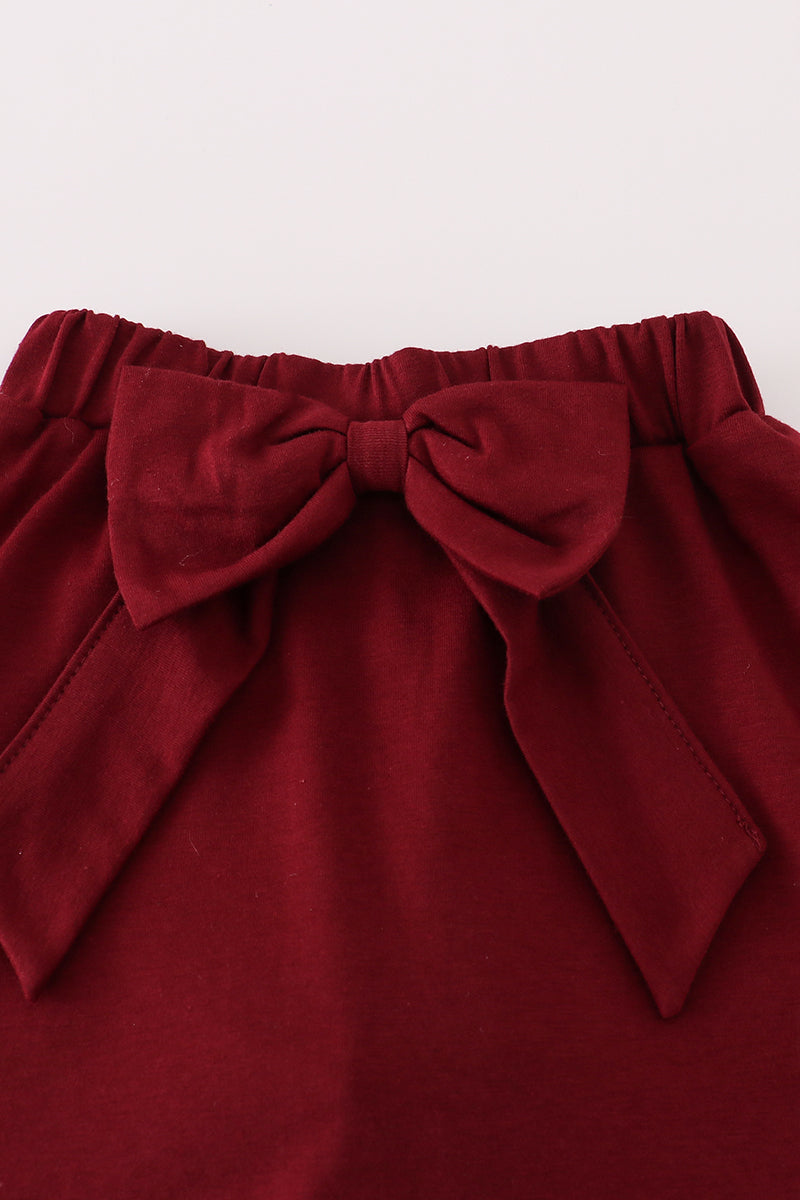 Red skirt with a large bow on a white background