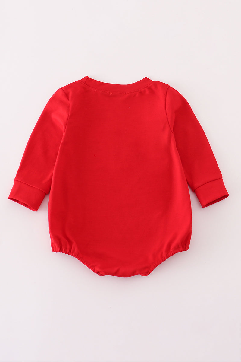 Red baby romper on a white background