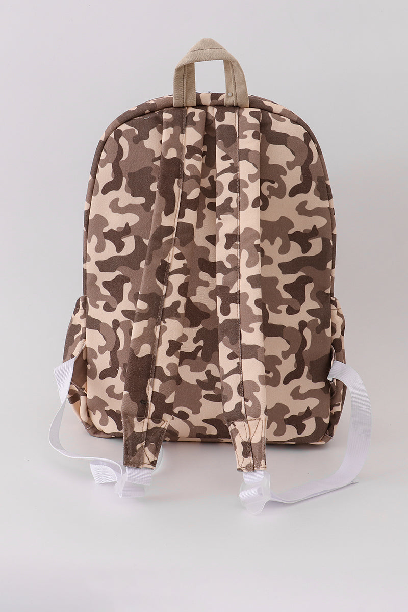 Camouflage-patterned backpack on a light gray background