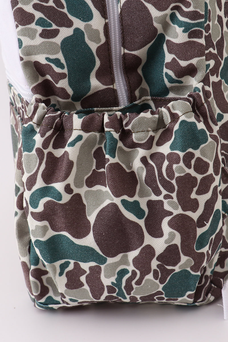 Camouflage-patterned fabric with a zipper on a white background