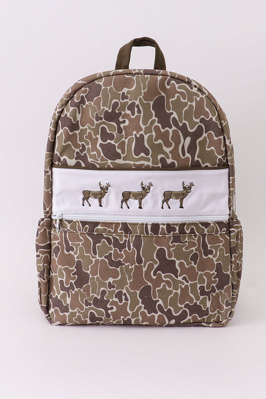 Camouflage-patterned backpack with deer illustrations on a white background