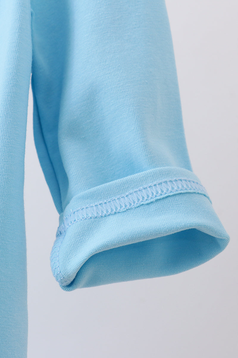 Close-up of light blue fabric with a white background