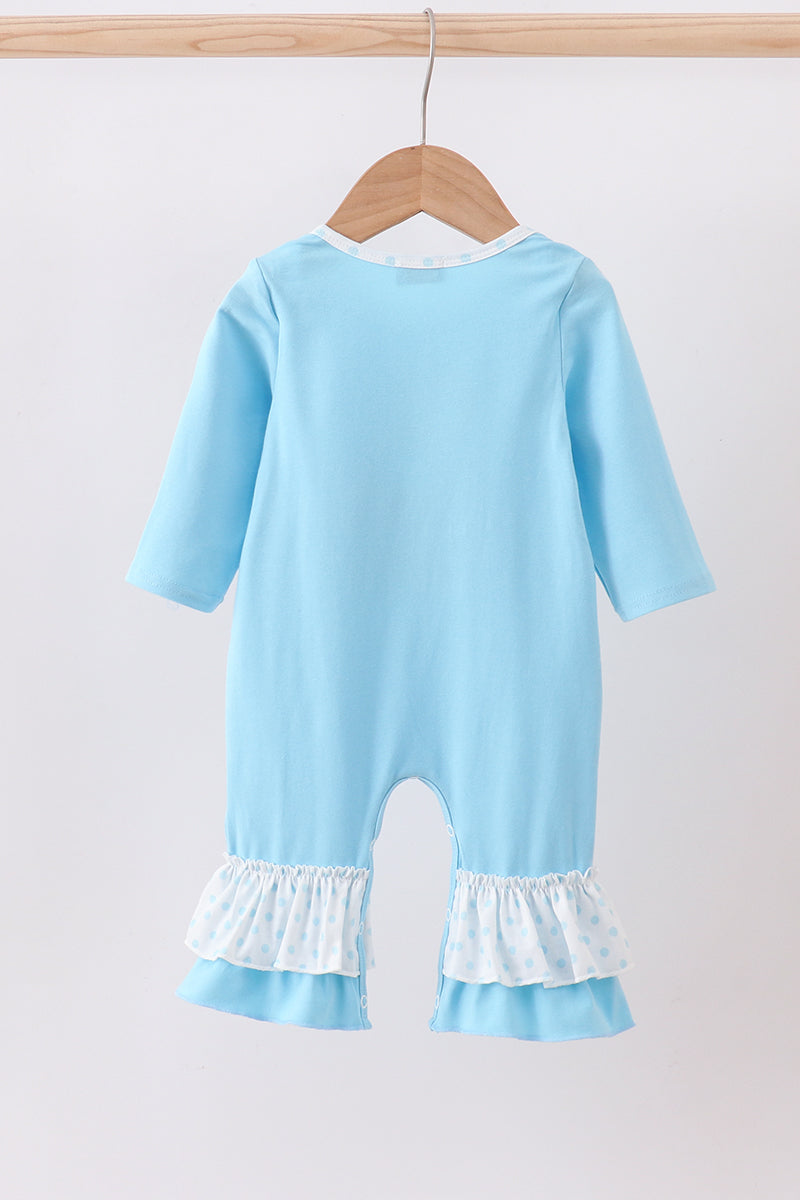 Light blue baby romper with ruffled legs on a hanger against a white background