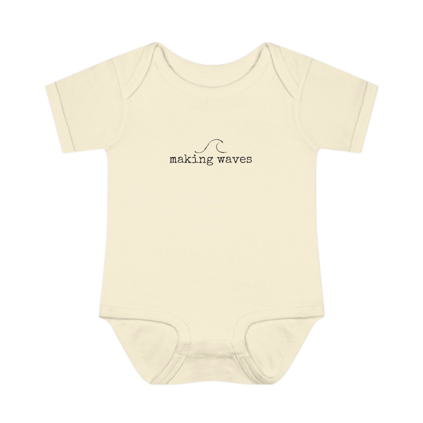 Beige baby onesie with 'making waves' text on a white background