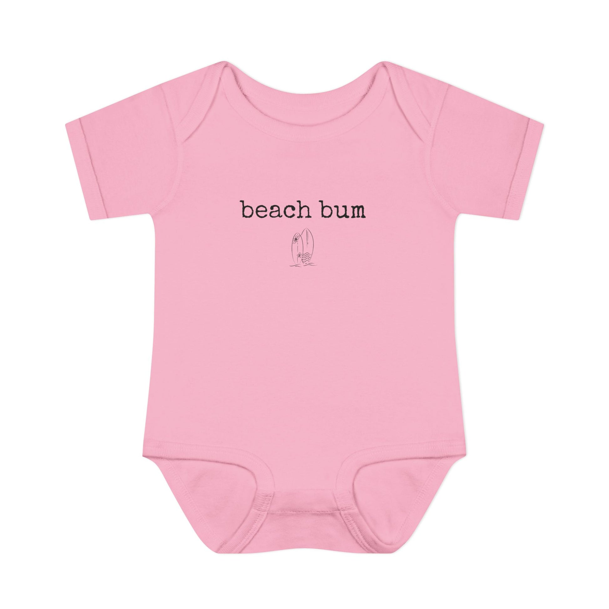 Pink baby onesie with 'beach bum' text on a white background