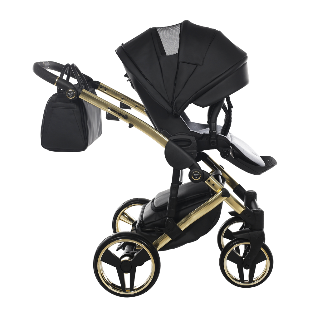 Black and gold baby stroller on a white background