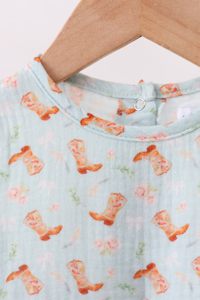 Light blue shirt with orange cowboy boot pattern on a white background