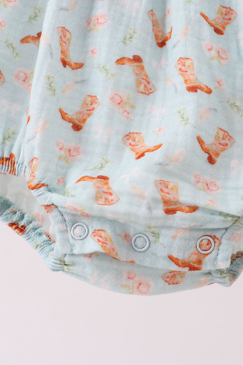 Baby romper with floral pattern on a light background
