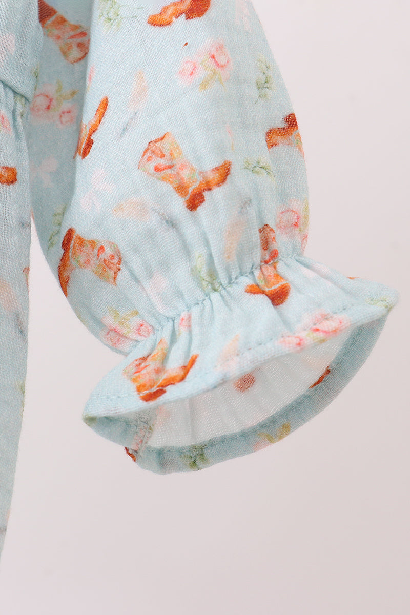 Floral-patterned fabric with ruffled edge on a light background