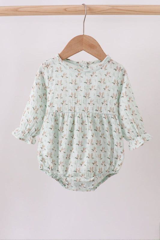 Mint green baby romper with floral pattern on a wooden hanger against a white background