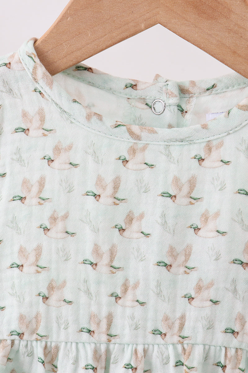 Light green dress with bunny print on a white background