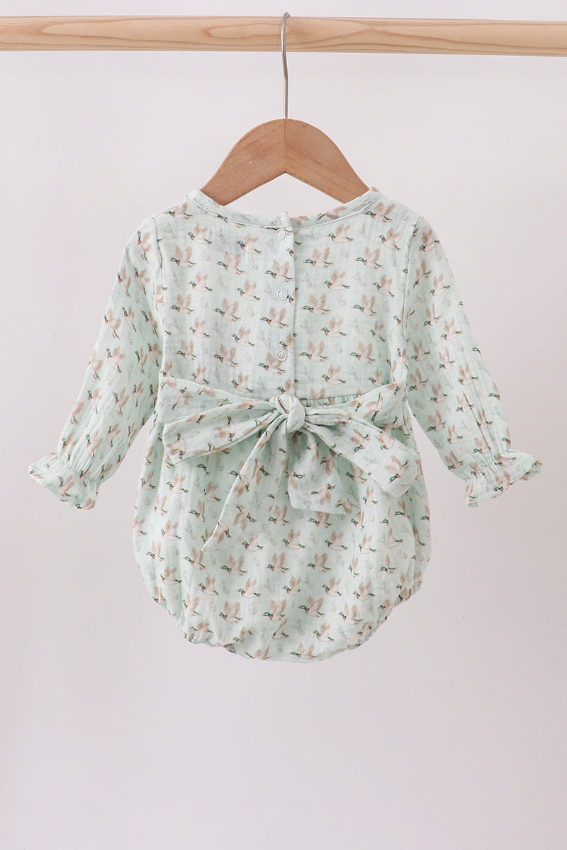 Mint green floral baby romper on a wooden hanger against a white background