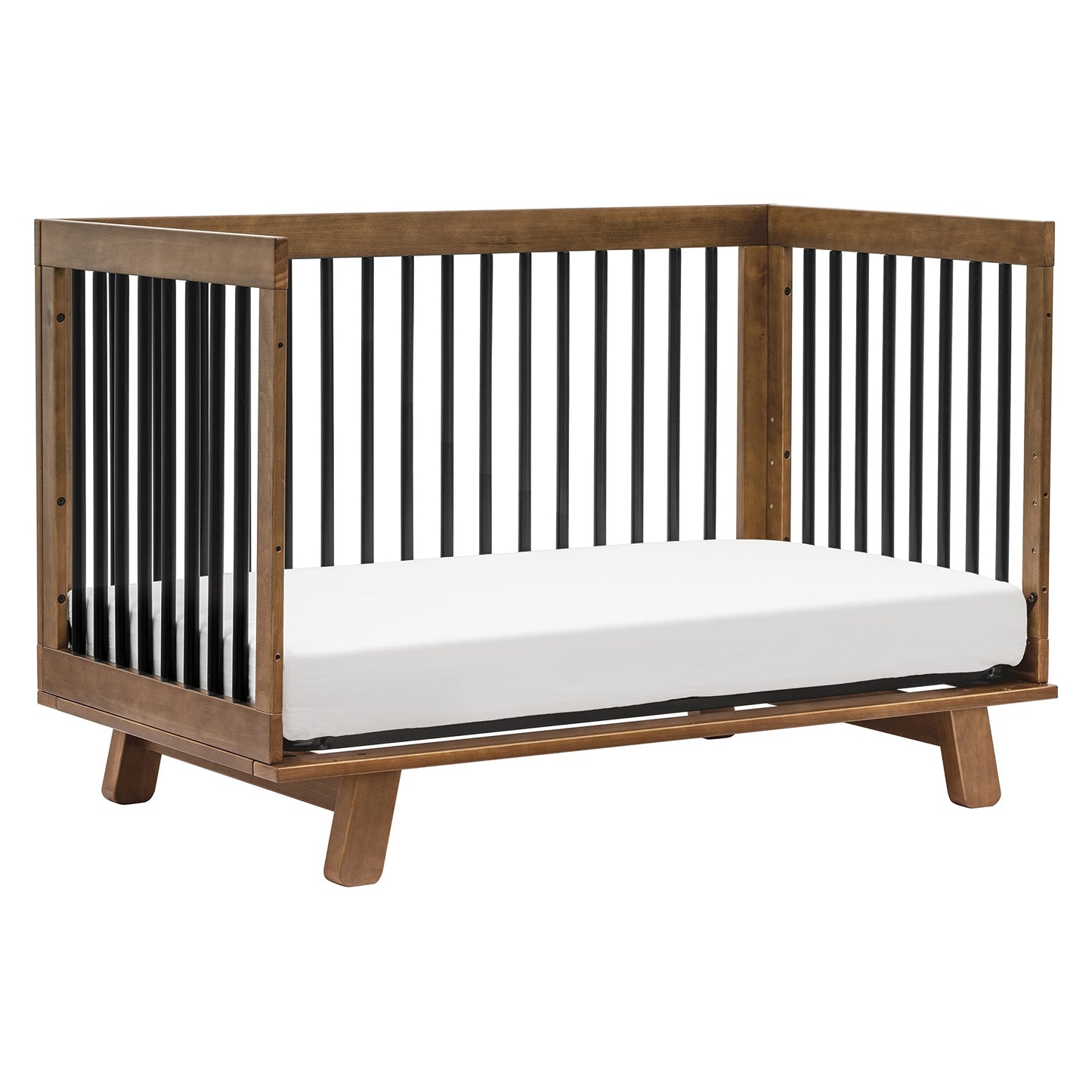 Wooden crib with black bars on a white background
