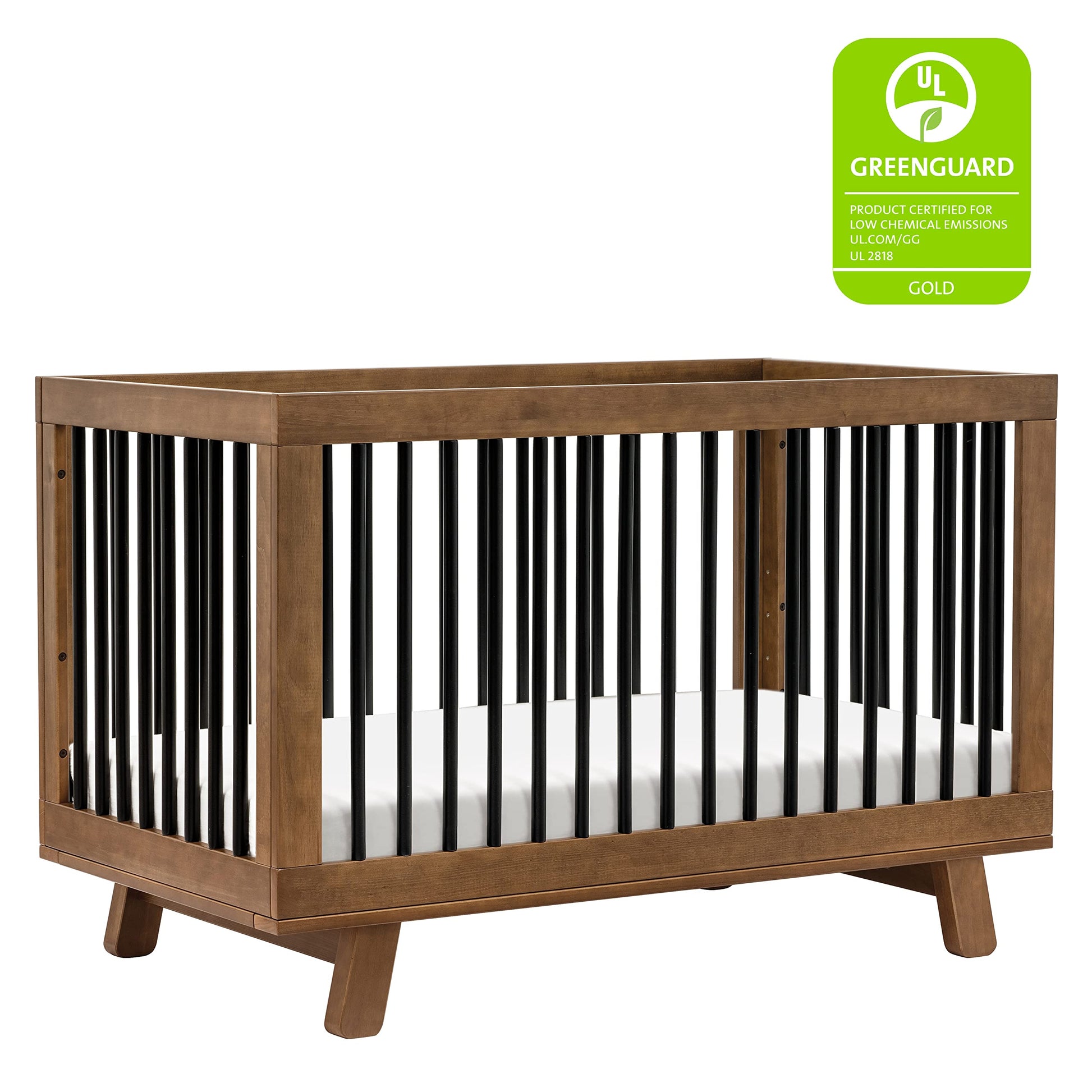 Wooden crib with black and white striped sides and Greenguard Gold certification badge on a white background