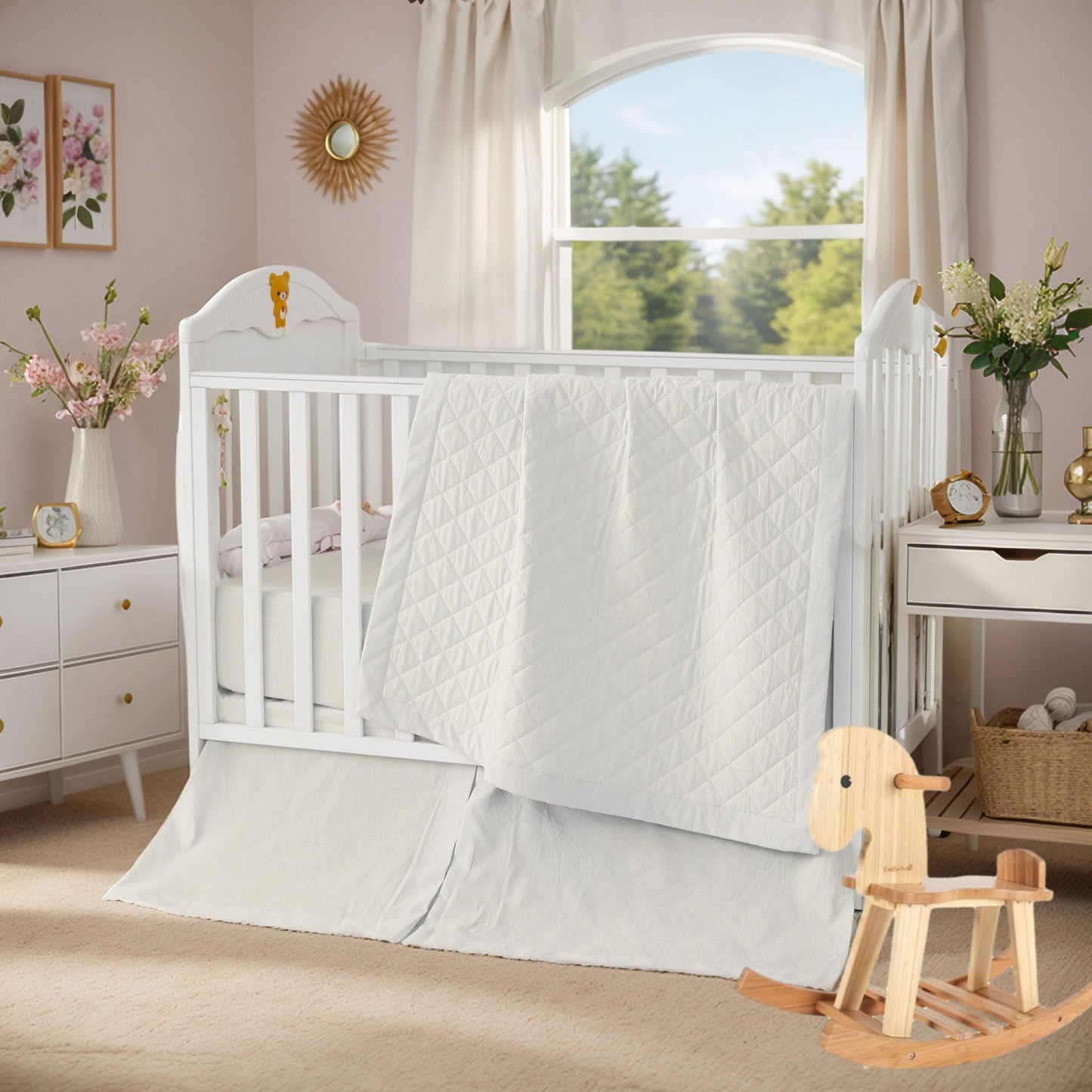 White crib with a wooden rocking horse in a nursery with a window and decor.