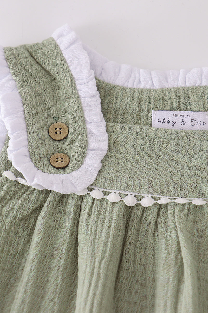 Green baby dress with white ruffled collar and buttons, featuring 'Abby & Eric' label.