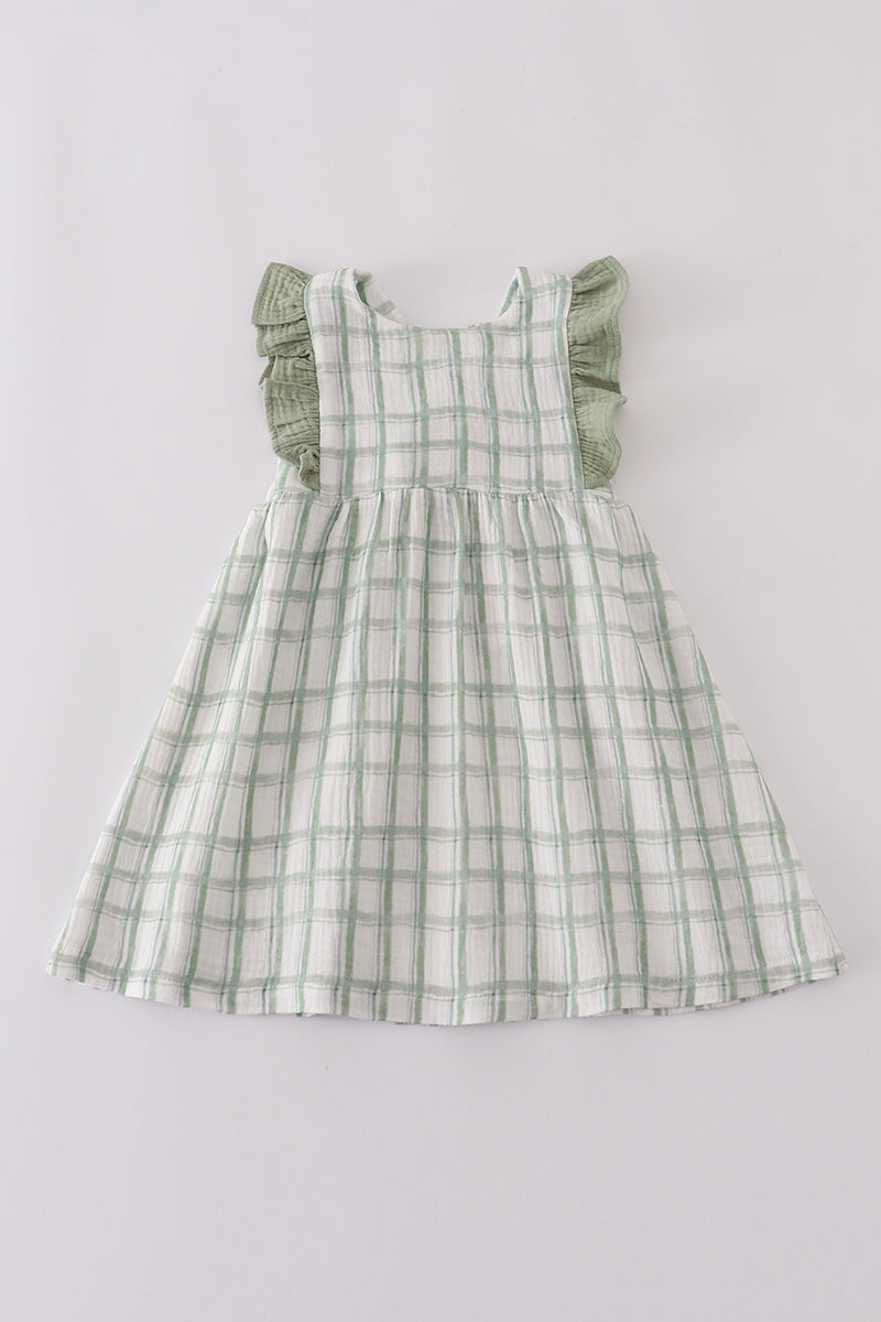 Green checkered dress on a light gray background